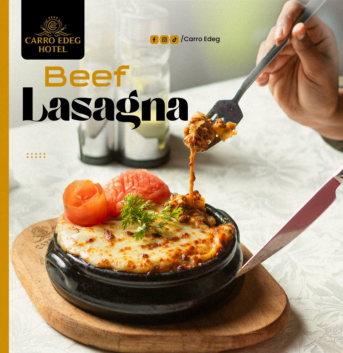 A restaurant menu or promotional card for Carro Edeg Hotel featuring a photo of Beef Lasagna. The image shows a hot black stone plate with melted cheese, tomato slices, and herbs, with a hand holding a fork lifting a piece of the lasagna.